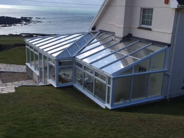 Wrap around conservatory with portal frame